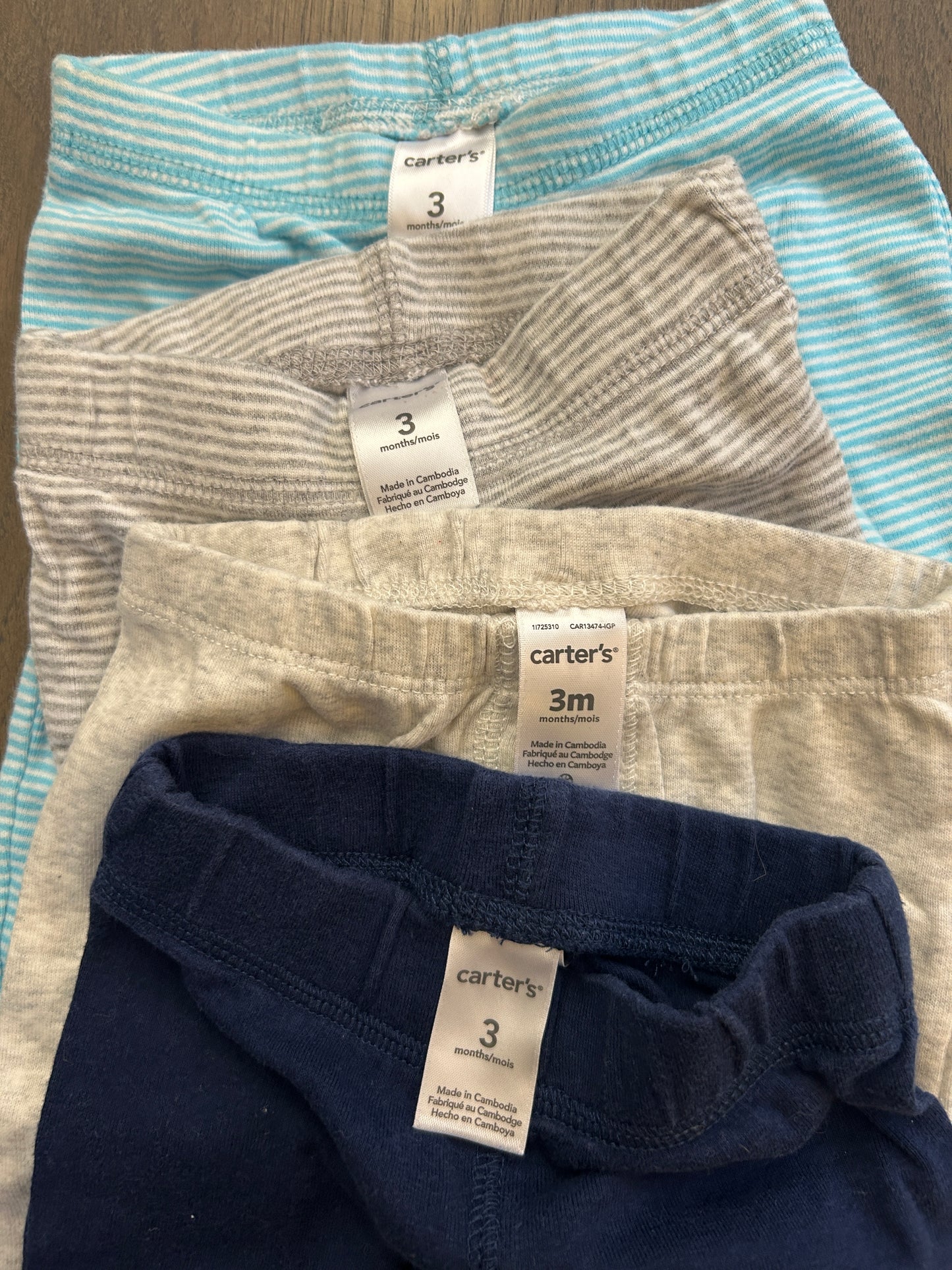Lot of Carter’s two onesies, four pants, boy, size 3 months
