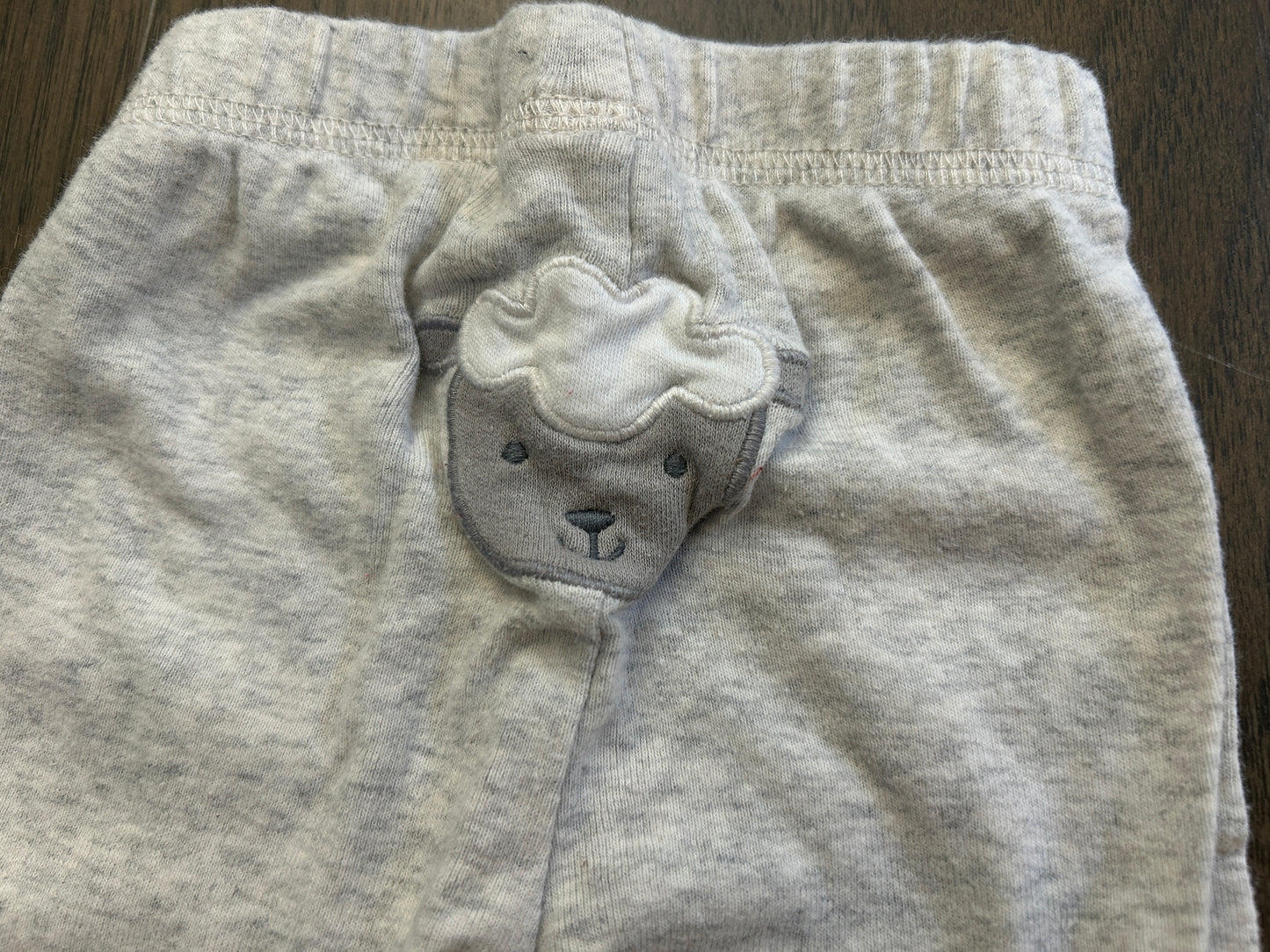 Lot of mixed brands, five short sleeve onesies and six pants, boy, size 0-3 months